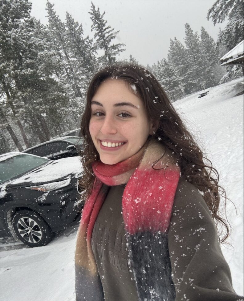 Picture of Emily Grevler smiling outside in the snow.