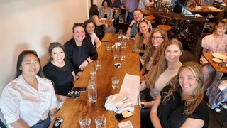 Group photo of the APPL team at a restaurant.