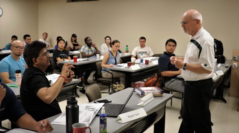 People listening to Dr. Zbigniew Lewandowski.