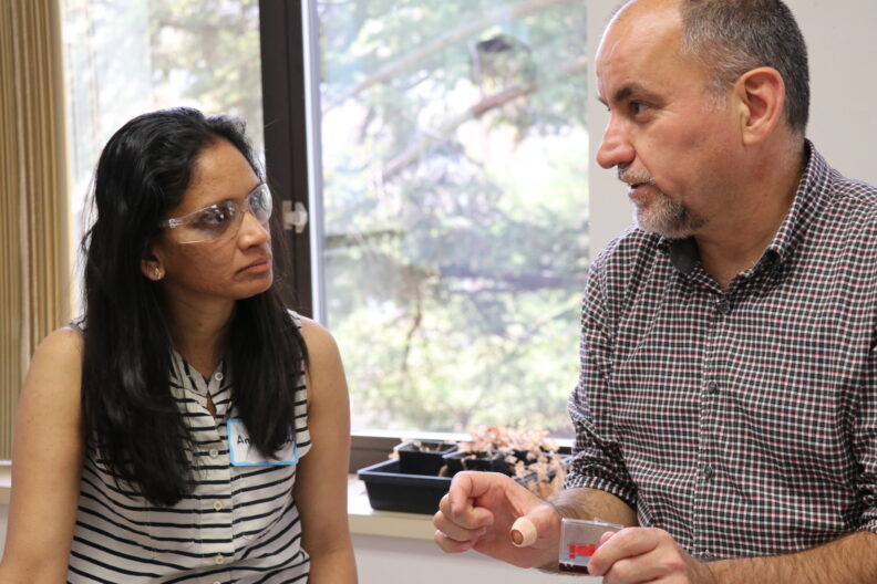 Dr. Haluk Beyenal talking to a student.