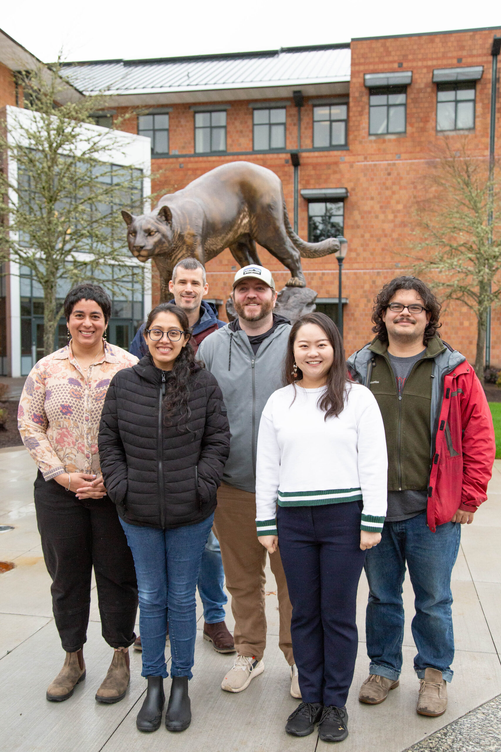 Group photo in front of bronze cougar statue.