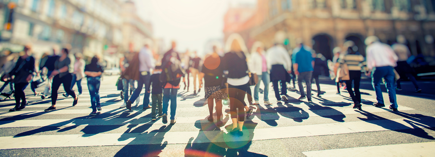 People walking on a crosswalk in the city