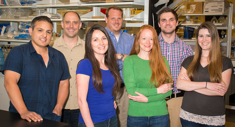 Faculty and staff from the Frank Lab standing and smiling.