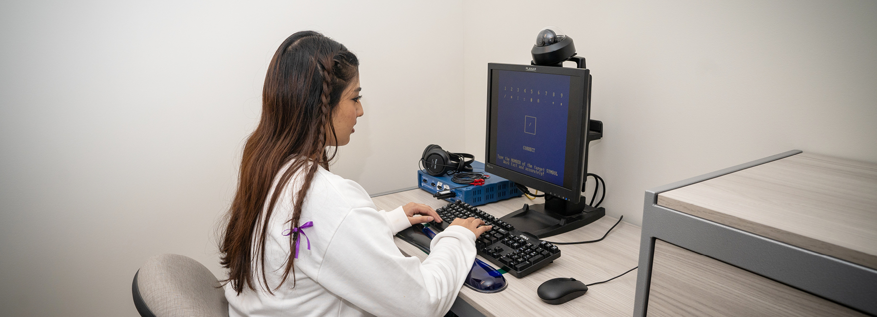 Volunteer taking a test on computer
