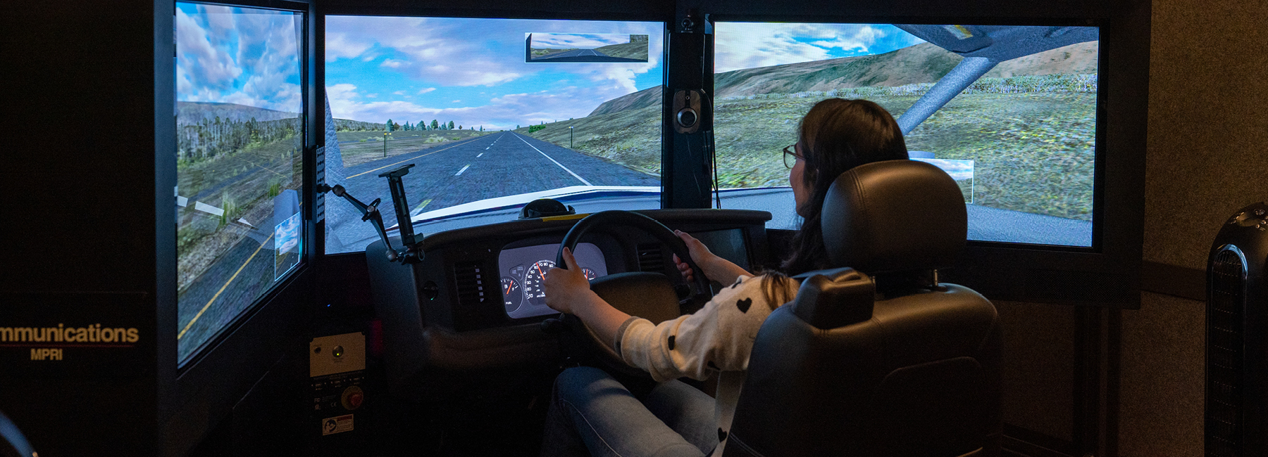 Volunteer taking driving simulation test