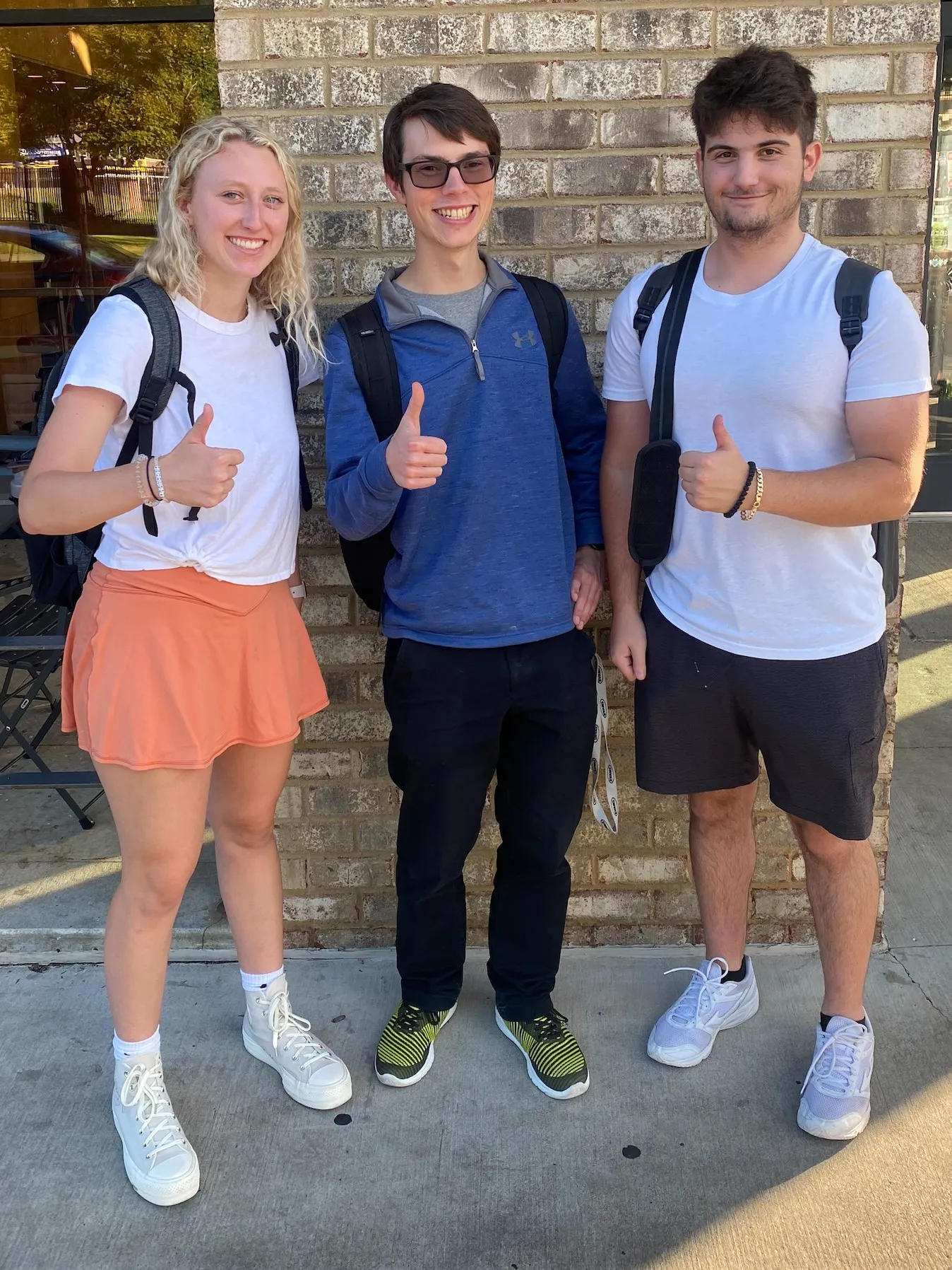 Alexis, Chad, and George in front of Chipotle