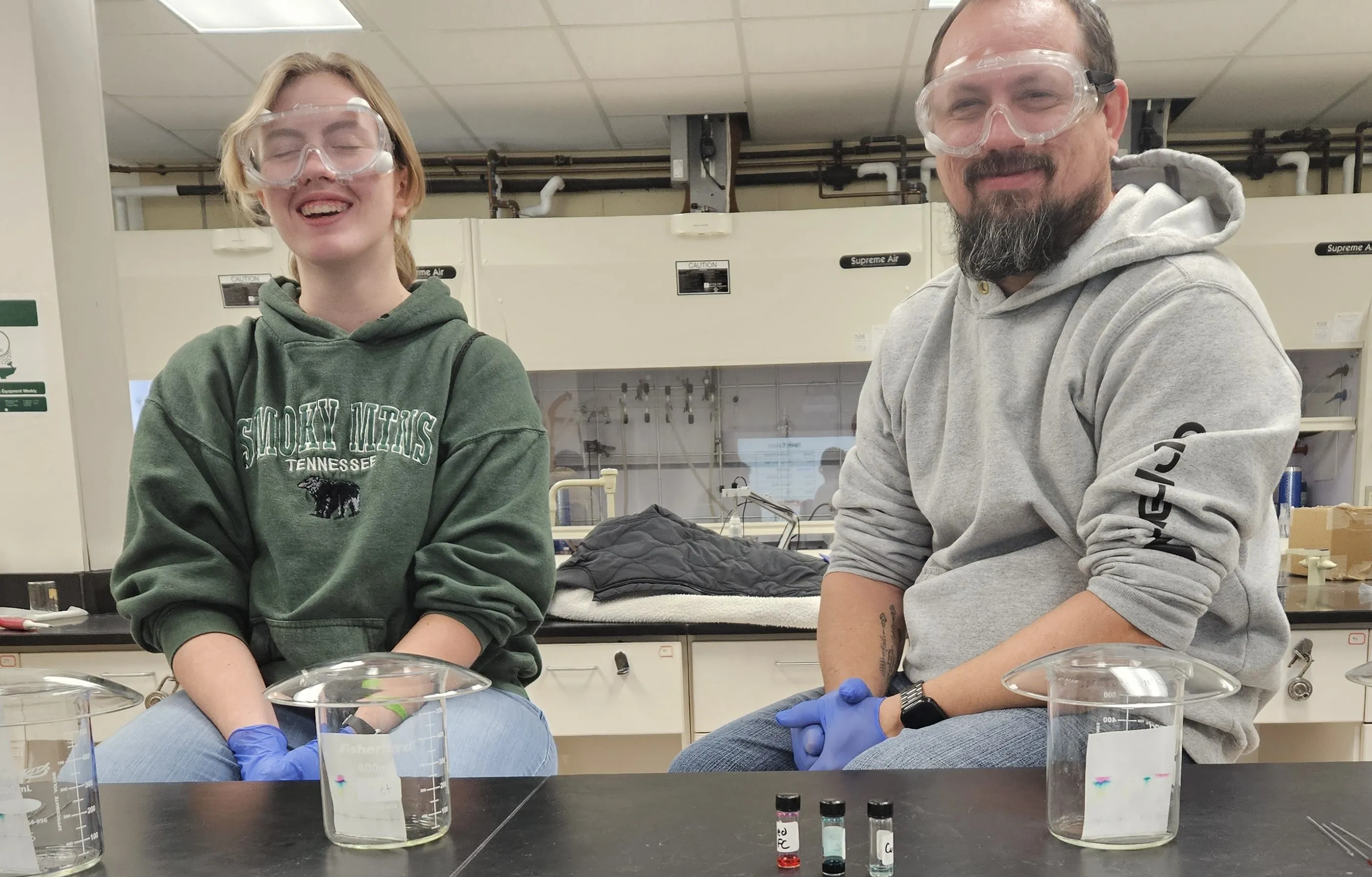 A prospective University of Akron chemistry student and her father performing a chromatography experiment