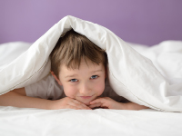 Child under blanket