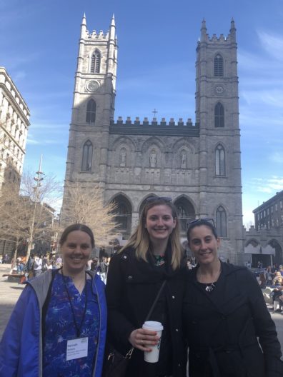 3 members of the lab at INSAR 2019 standing in front of building