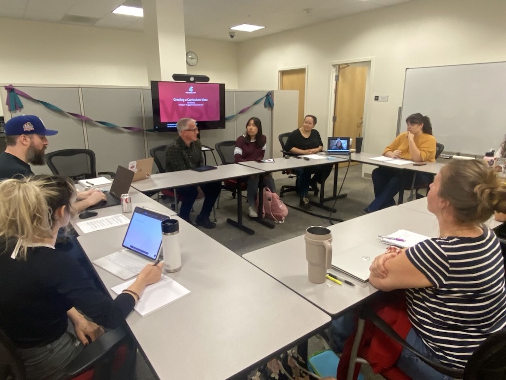 A photo of a lab meeting on CVs with Bill Stahley