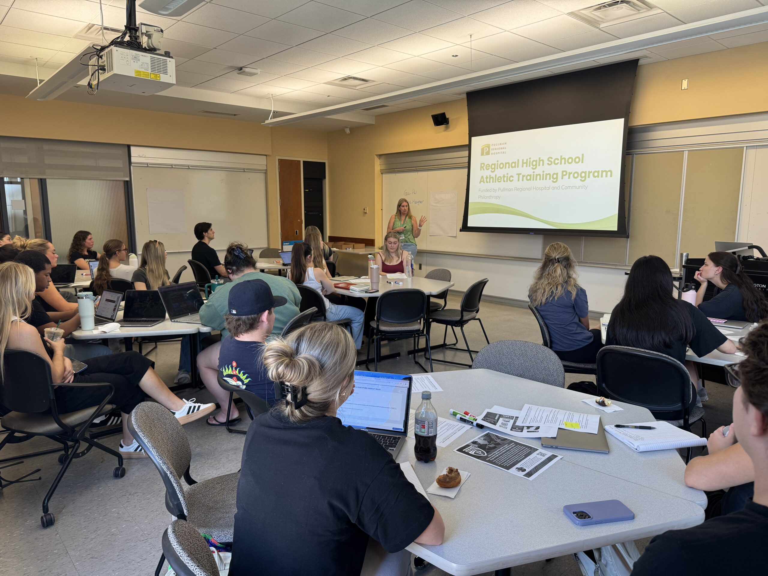 Service Learning students learning about their project.