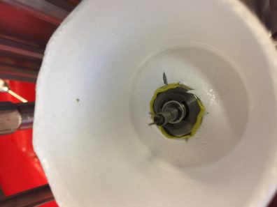 Styrofoam cup fit around hotwire plug image.