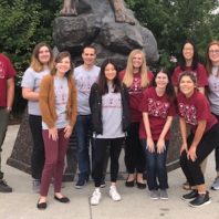 WSU lab students group picture in front of cougar statue