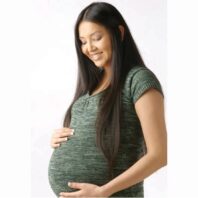 Pregnant woman looking down