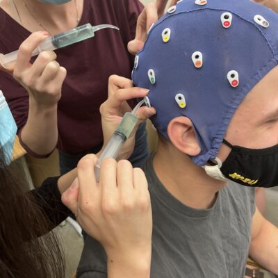 Student researchers training with research cap