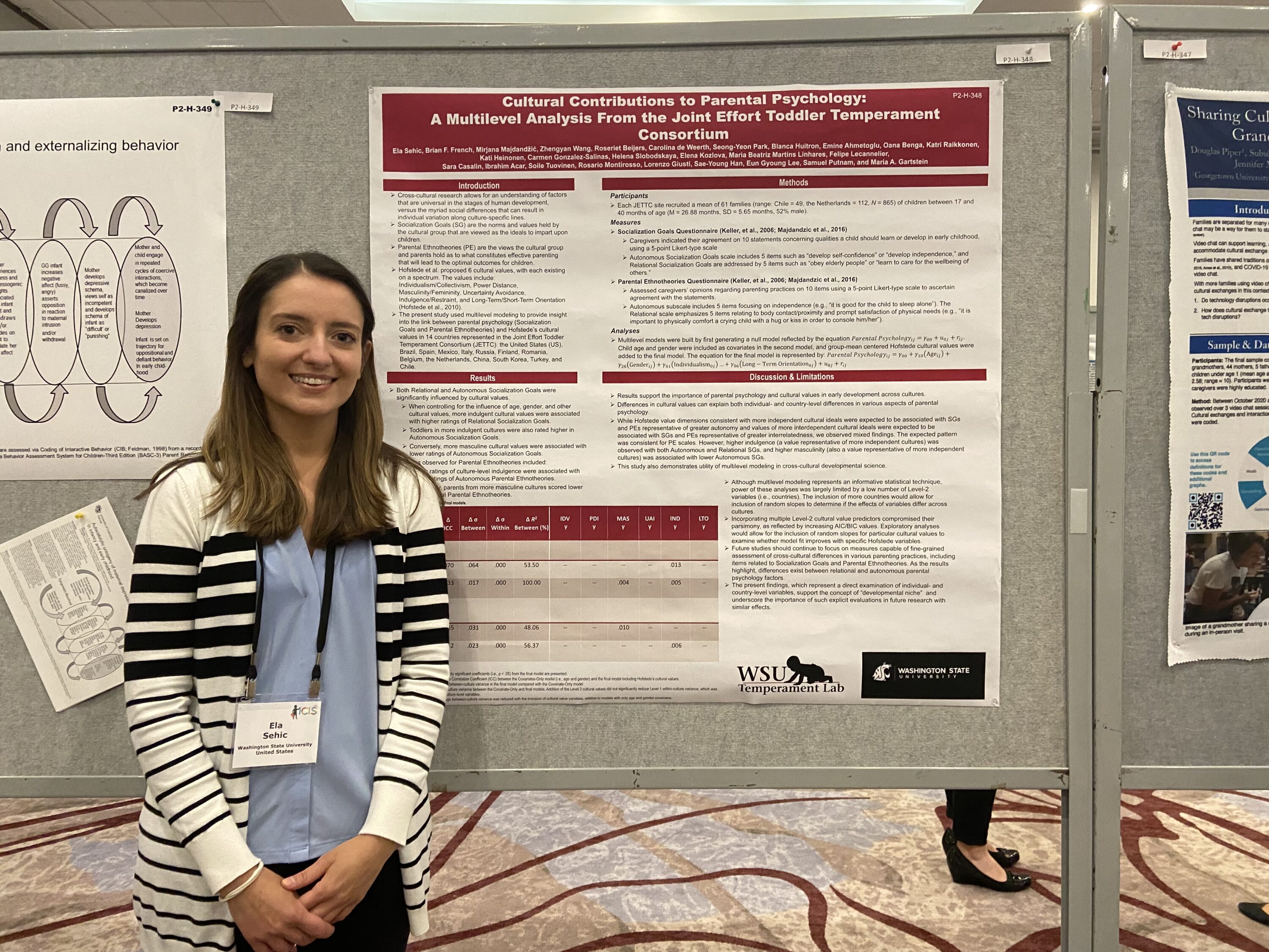Female student standing next to a presentation board