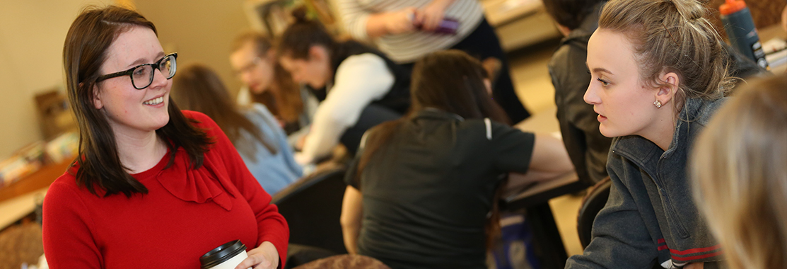 Students interacting in a classroom.