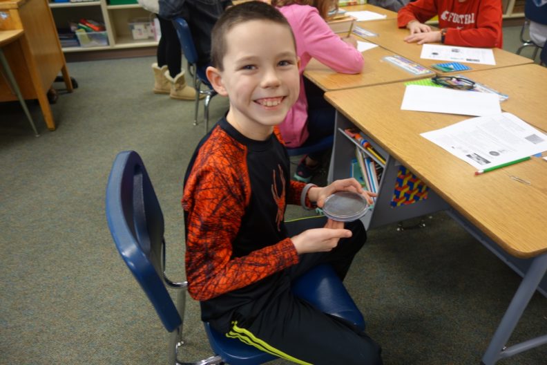 Jefferson elementary student with magnets