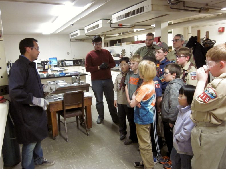 Jose giving glassmelting instruction