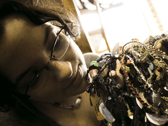 Sarah Williams with necklaces for sale.