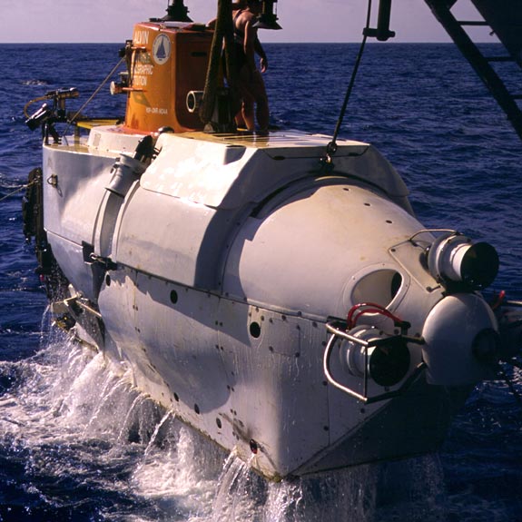 Ballast water rushes out as Alvin is lifted from the sea. Photo Deep-sea Photography.