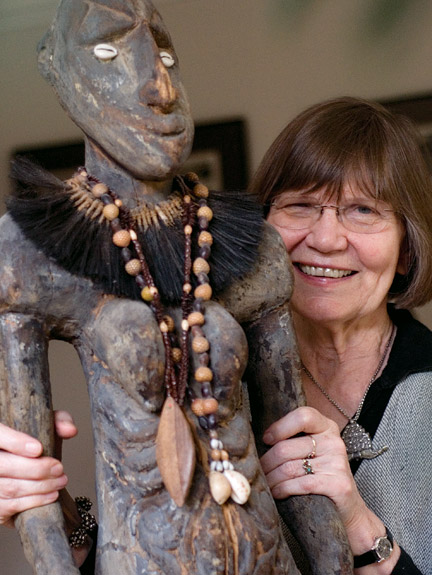 Ellen Dissanayake with a carving of a 'yam goddess' from Papua New Guinea