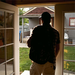 A student heads out the door of Stepping Stones Recovery House. The small home on College Hill offers students in treatment a place to live that's free from drugs and alcohol.