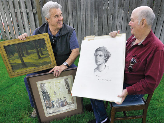 Bob Brumblay (left) and Dave Fitzsimmons holding works by Griffin