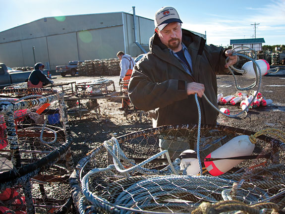 Brian Toste prepares a crab trap