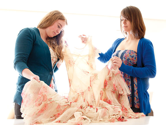 Students researching the history of a 1930s clothing acquisition 