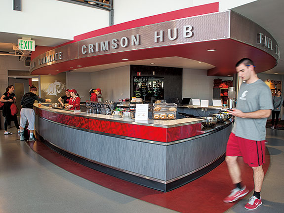 What’s New? The Crimson Hub delivers nutritious food to athletes in the Bohler weight room. Read about sports nutrition here. Photo Robert Hubner