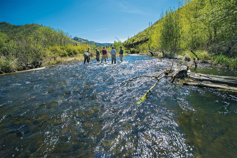 Researchers place piezometers in the river bed. Photo Shelly Hanks