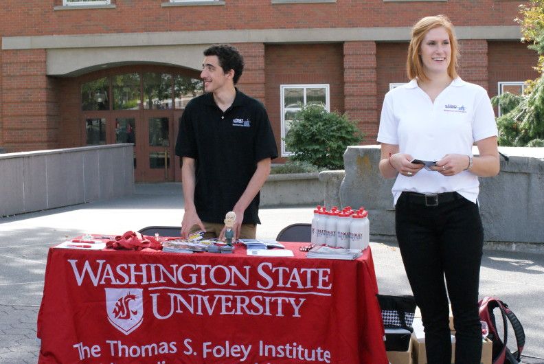 Stephanie Logan and a fellow student at Constitution Day in 2014. At the Foley-sponsored event, students hand out pocket Constitutions and other Foley gear on campus. Courtesy Stephanie Logan