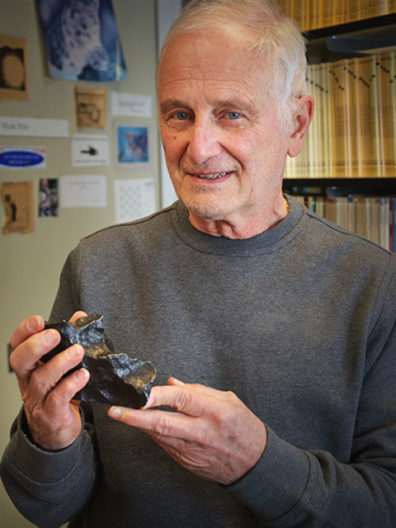 Nick Foit holding a meteorite. Staff photo