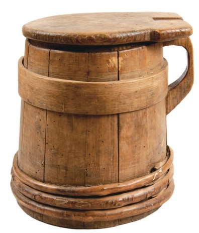 Late 1700s staved wooden tankard in pine construction, typical of New England. From listing by Early American at liveauctioneers.com.