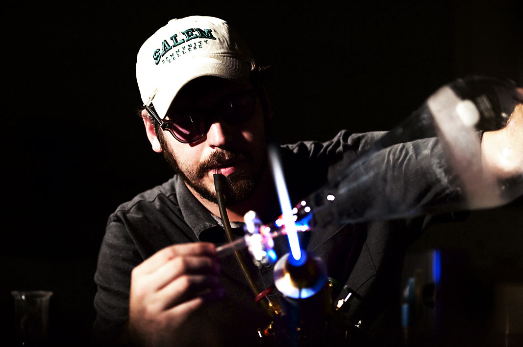 Aaron Babino repairing glassware
