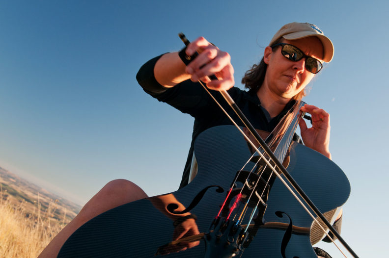 Ruth Boden plays cello on Kamiak Butte. Photo Zach Mazur.