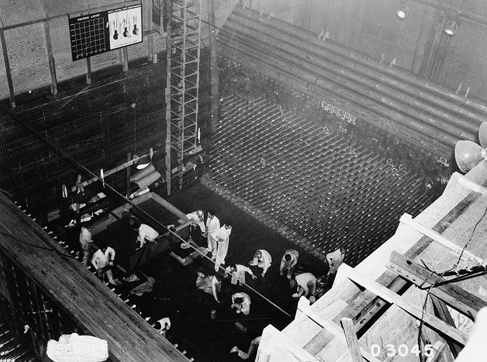 Workers laying up the graphite core of the 105-B file