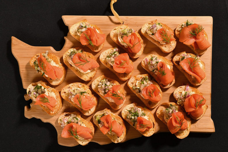 Salmon crostini on Washington state shaped board