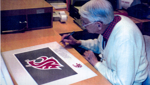 Randall Johnson signing WSU logo poster