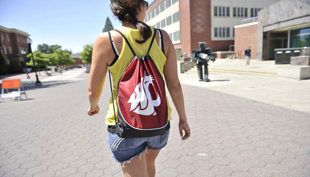 WSU student with Cougar logo backpack