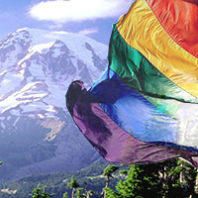 Gay Pride flag in front of Mt. Rainier
