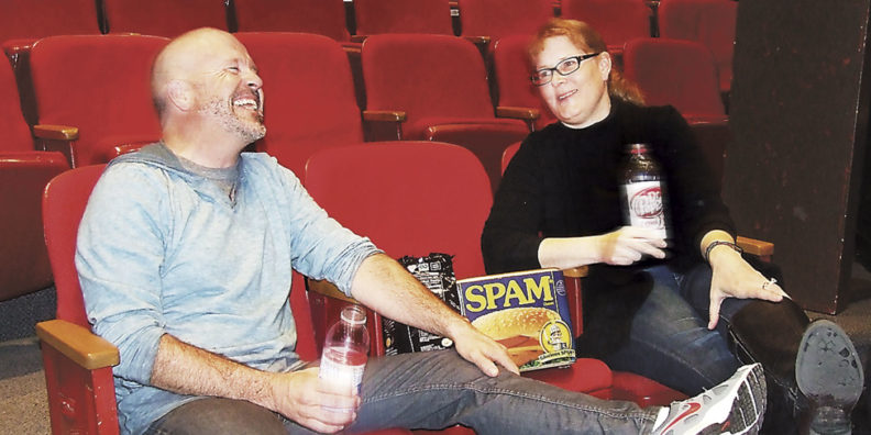 Paul and Kelly Atwood laugh at theater