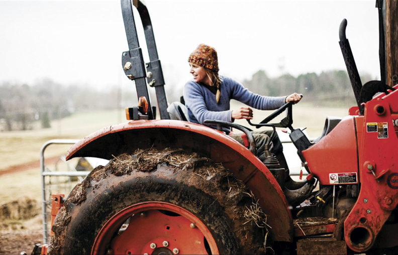 Woman farmer on tractor