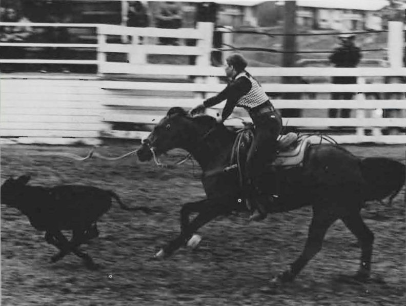 Woman calf roping at WSU, 1973