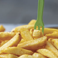 French fries with a fork. Photo Gilly/Unsplash