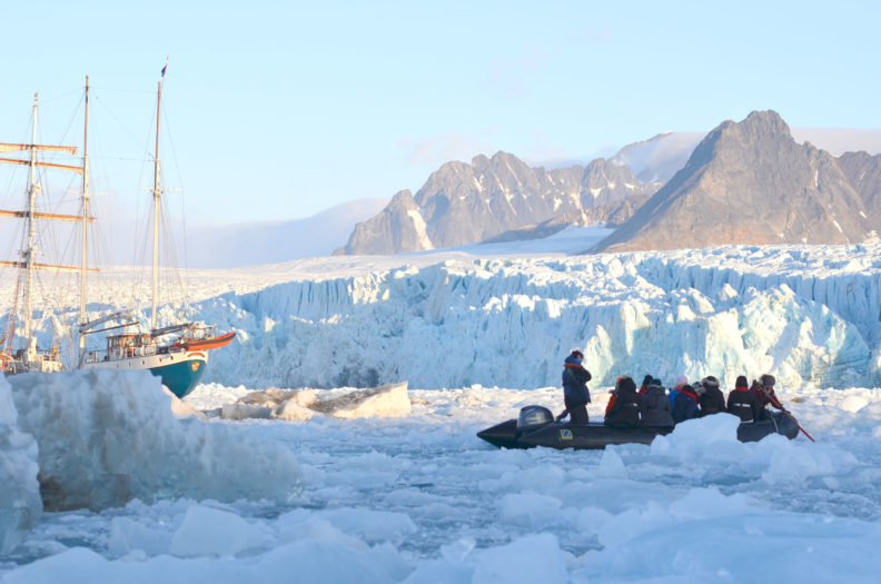 Small boat exploring the Arctic ice near Svalbard. Photo Debbie Lee