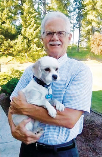 Robert Slack holding a dog