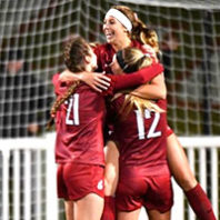 WSU soccer players celebrate a goal