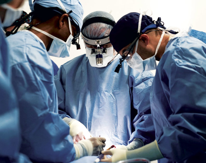 Doctors performing surgery in Guatemala.
